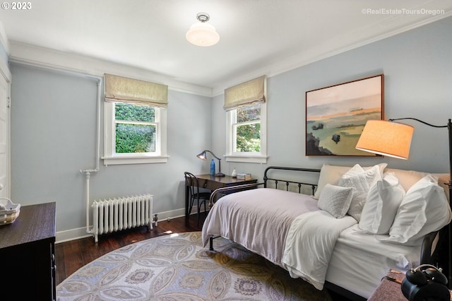 bedroom with dark hardwood / wood-style flooring, radiator heating unit, and crown molding