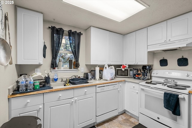 15745 NE Beech St, Portland, OR 97230 - kitchen featuring white appliances, under cabinet range hood, white cabinets, and light countertops