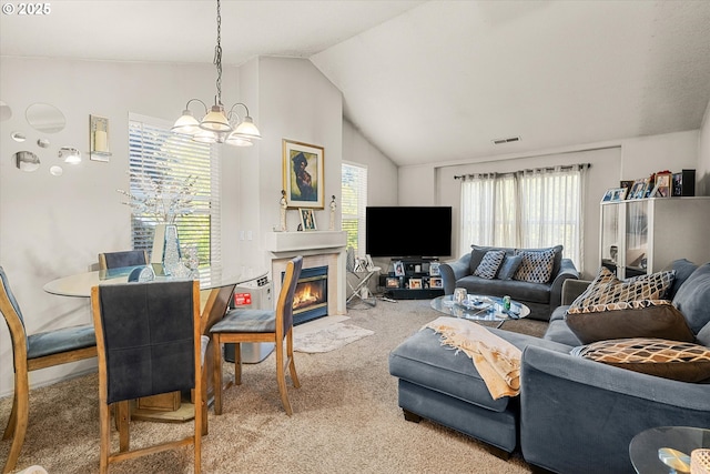 15745 NE Beech St, Portland, OR 97230 - carpeted living area featuring lofted ceiling, a chandelier, and a fireplace with flush hearth