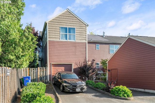 15745 NE Beech St, Portland, OR 97230 - view of side of property featuring a garage and driveway