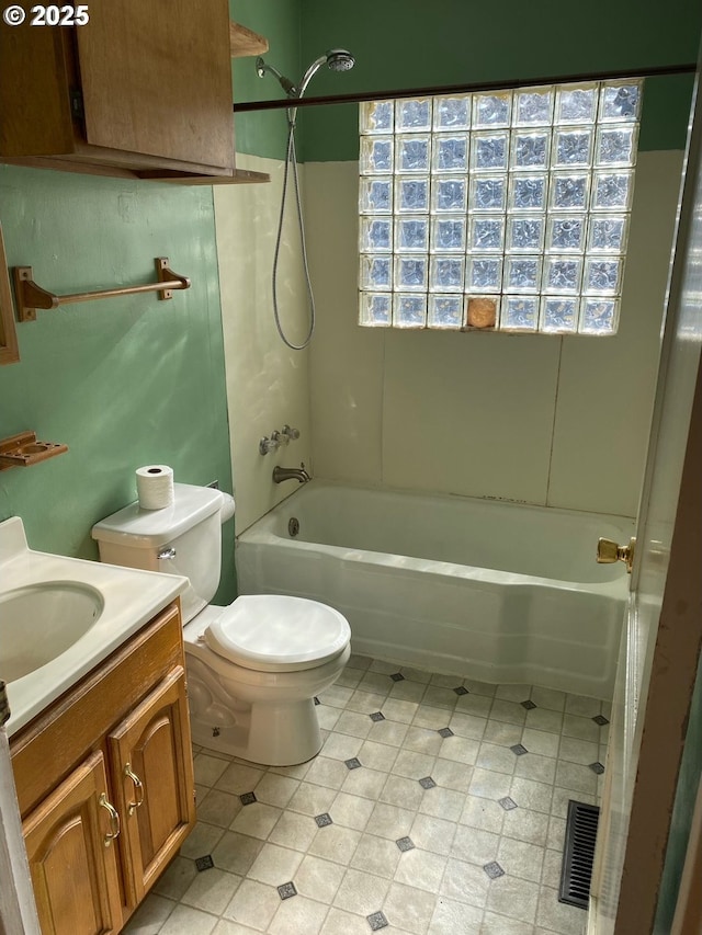 full bathroom featuring toilet, shower / bath combination, and vanity