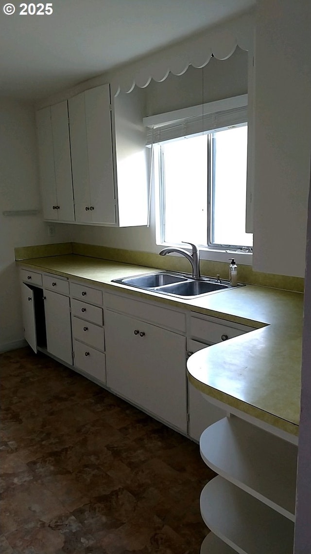 kitchen with sink and white cabinets