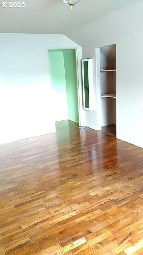 spare room with wood-type flooring