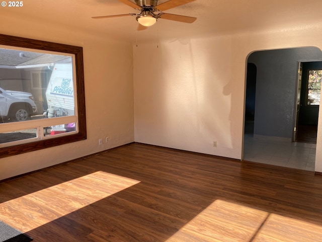 spare room featuring hardwood / wood-style flooring and ceiling fan