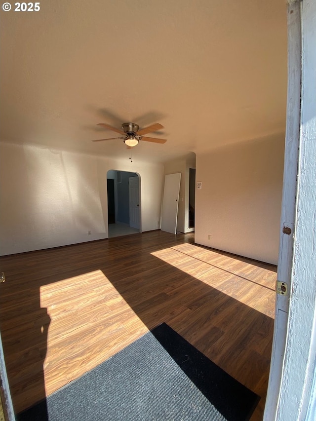 unfurnished room with hardwood / wood-style floors and ceiling fan