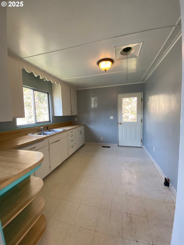 kitchen with sink and white cabinetry