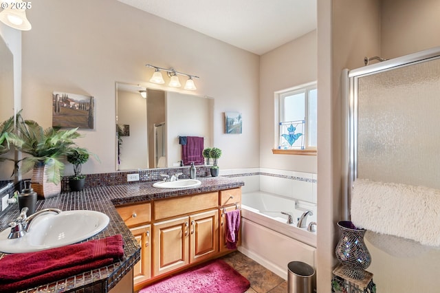 18989 NE Marine Dr Unit 44, Portland, OR 97230 - full bathroom with double vanity, a bath, a stall shower, and tile patterned flooring