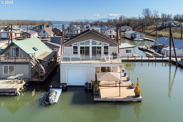 dock area with a residential view and a water view