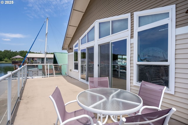 18989 NE Marine Dr Unit 44, Portland, OR 97230 - view of patio / terrace with a water view and outdoor dining area
