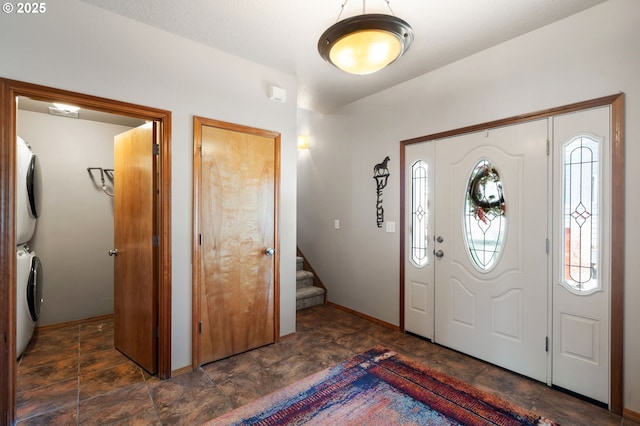 18989 NE Marine Dr Unit 44, Portland, OR 97230 - entryway featuring estacked washer and dryer, stairs, and stone finish flooring