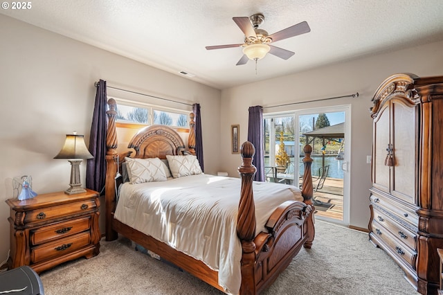 bedroom with multiple windows, light carpet, access to outside, and visible vents