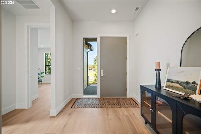 entrance foyer featuring light wood-type flooring, baseboards, visible vents, and recessed lighting