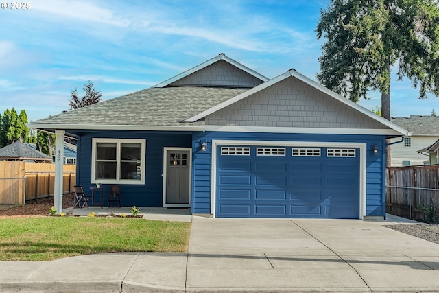 427 NW Garibaldi St, Hillsboro, OR 97124 - view of front facade featuring concrete driveway, an attached garage, a shingled roof, and a porch