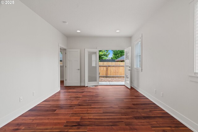 427 NW Garibaldi St, Hillsboro, OR 97124 - unfurnished room featuring recessed lighting, dark wood-style floors, and baseboards