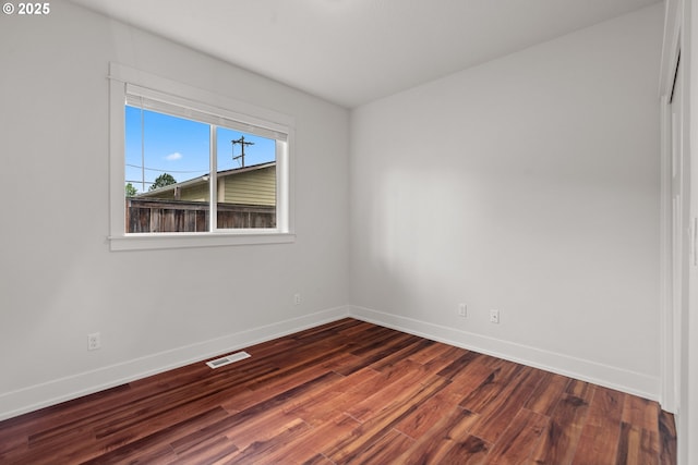 427 NW Garibaldi St, Hillsboro, OR 97124 - unfurnished room with baseboards and dark wood finished floors
