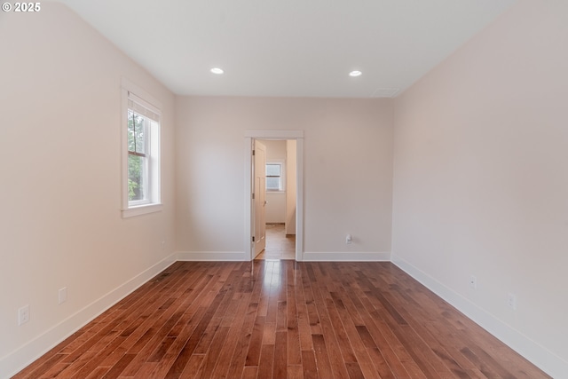 427 NW Garibaldi St, Hillsboro, OR 97124 - empty room with wood finished floors, baseboards, and recessed lighting