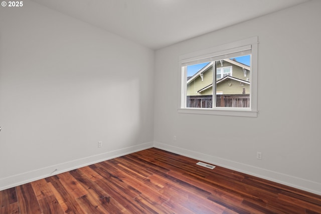 427 NW Garibaldi St, Hillsboro, OR 97124 - spare room featuring baseboards and dark wood finished floors