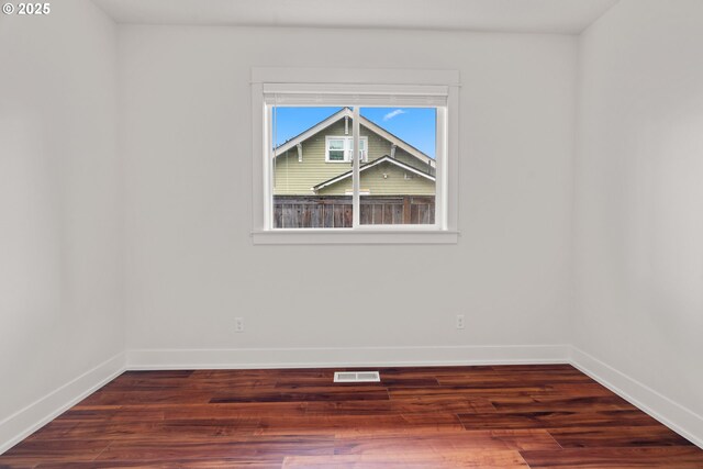 427 NW Garibaldi St, Hillsboro, OR 97124 - spare room with baseboards and wood finished floors