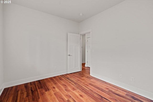 427 NW Garibaldi St, Hillsboro, OR 97124 - spare room featuring light wood-style floors, baseboards, and a smoke detector