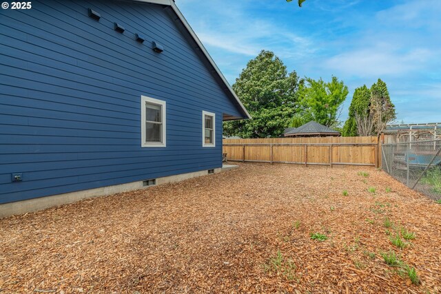 427 NW Garibaldi St, Hillsboro, OR 97124 - view of home's exterior with a fenced backyard and crawl space