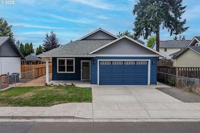 427 NW Garibaldi St, Hillsboro, OR 97124 - view of front of home with a garage, driveway, and roof with shingles