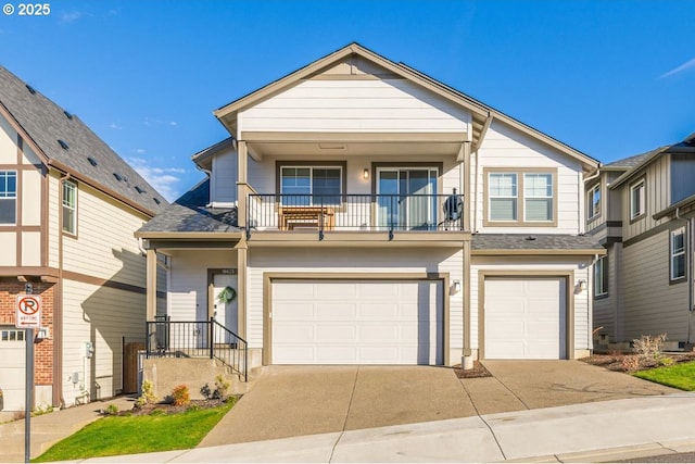 view of front of home featuring a garage, driveway, a balcony, and a shingled roof