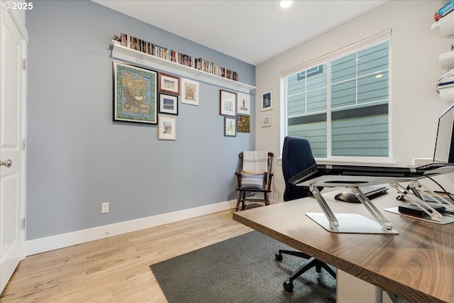 office area with wood finished floors and baseboards