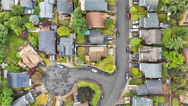 aerial view of property and surrounding area with nearby suburban area