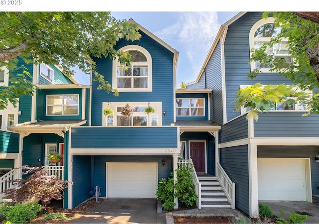 3540 S Corbett Ave, Portland, OR 97239 - view of front of home with an attached garage and asphalt driveway