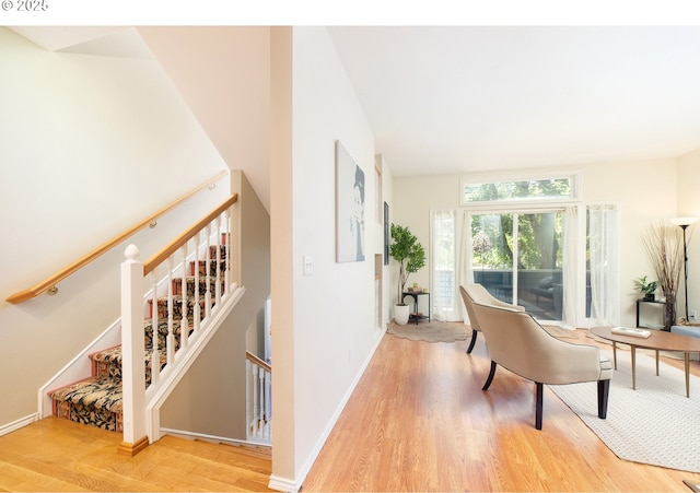 3540 S Corbett Ave, Portland, OR 97239 - corridor with light wood-type flooring, baseboards, and an upstairs landing