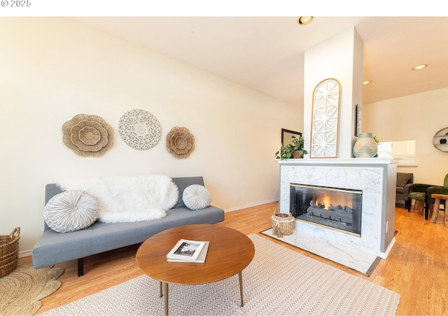 3540 S Corbett Ave, Portland, OR 97239 - living room with a fireplace, light wood-style floors, baseboards, and recessed lighting