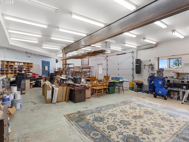 8801 SE Walnut Dr, Amity, OR 97101 - garage with a workshop area and a central vacuum unit