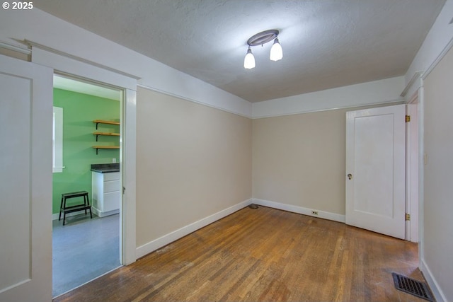 6115 SE 19th Ave, Portland, OR 97202 - unfurnished room featuring baseboards and wood finished floors