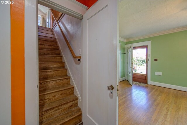 6115 SE 19th Ave, Portland, OR 97202 - staircase with wood finished floors and crown molding