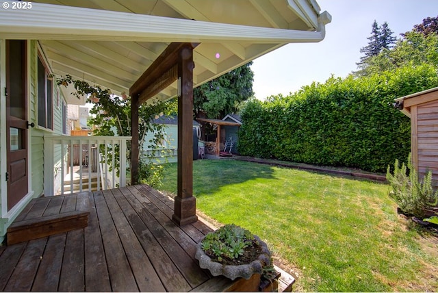 6115 SE 19th Ave, Portland, OR 97202 - wooden terrace with a lawn and a storage unit