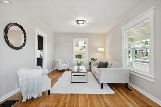 900 H St, The Dalles, OR 97058 - living room featuring wood finished floors and healthy amount of natural light