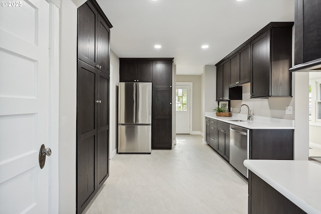 900 H St, The Dalles, OR 97058 - kitchen with appliances with stainless steel finishes, light countertops, recessed lighting, and dark brown cabinetry
