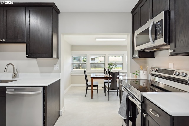 900 H St, The Dalles, OR 97058 - kitchen featuring stainless steel appliances, light countertops, and light flooring