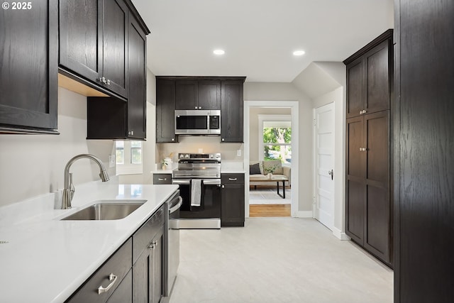 900 H St, The Dalles, OR 97058 - kitchen featuring appliances with stainless steel finishes, light countertops, recessed lighting, dark brown cabinets, and light flooring
