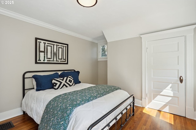 900 H St, The Dalles, OR 97058 - bedroom with wood finished floors and crown molding