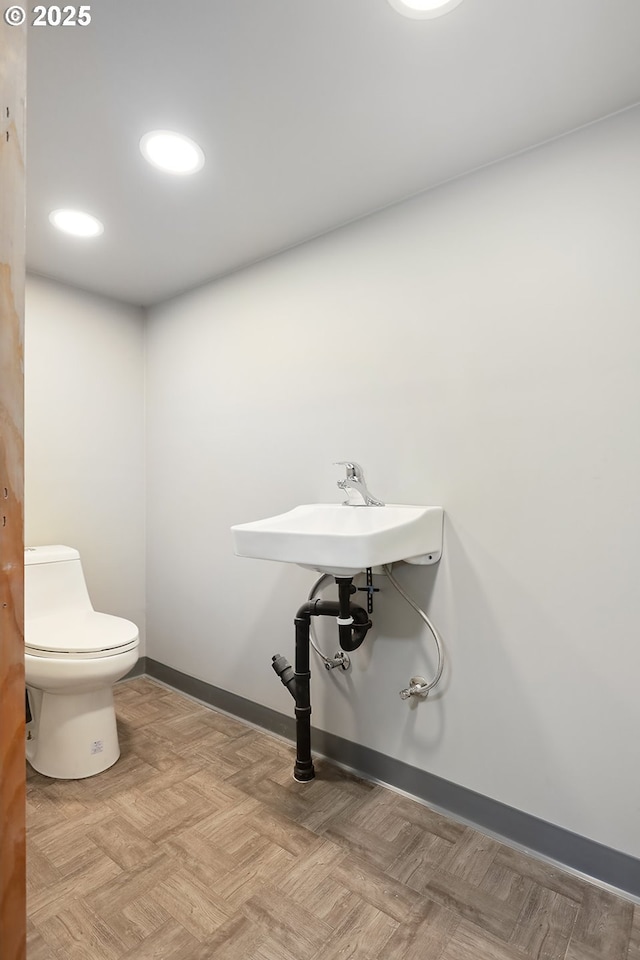 900 H St, The Dalles, OR 97058 - half bathroom with toilet and baseboards