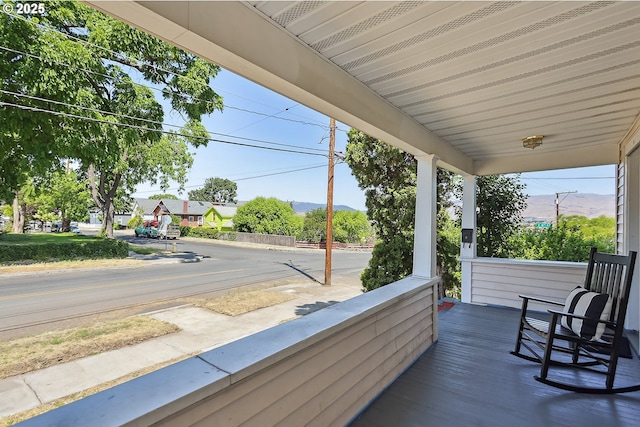 900 H St, The Dalles, OR 97058 - wooden porch featuring a mountain view