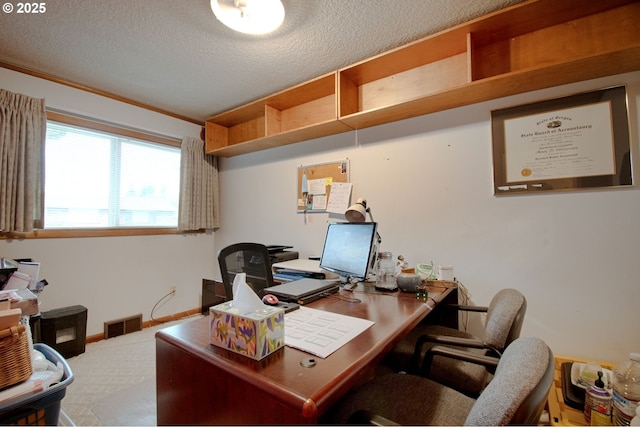 home office featuring visible vents, a textured ceiling, and baseboards