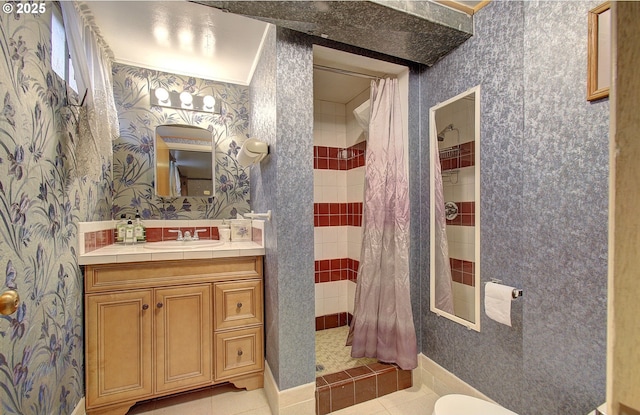 bathroom featuring tile patterned floors, toilet, a stall shower, wallpapered walls, and vanity