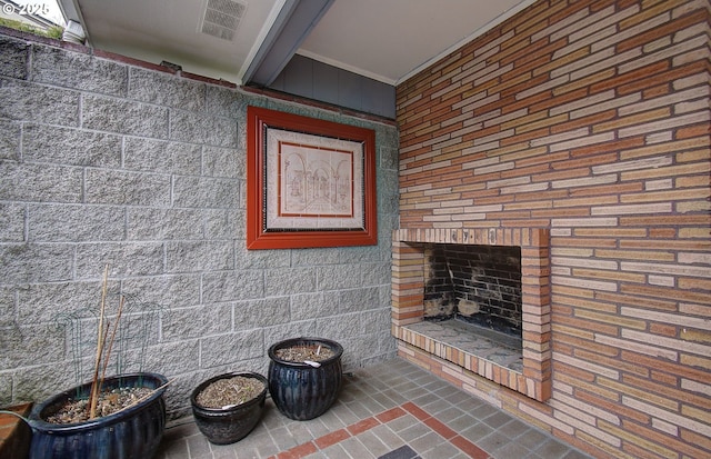 living area featuring a brick fireplace