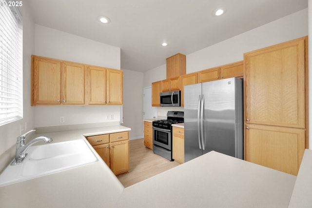 5298 Wales Dr, Eugene, OR 97402 - kitchen featuring light brown cabinetry, recessed lighting, a sink, light wood finished floors, and stainless steel appliances