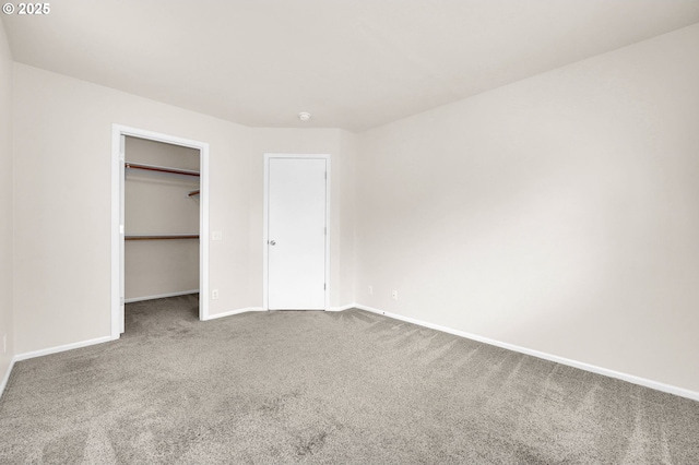 5298 Wales Dr, Eugene, OR 97402 - unfurnished bedroom with carpet flooring, baseboards, a walk in closet, and a closet