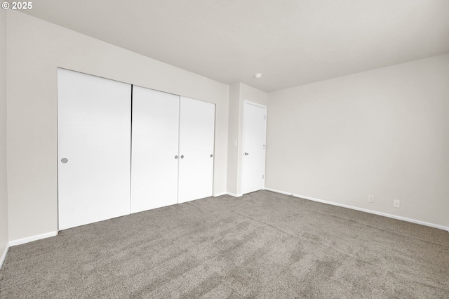 5298 Wales Dr, Eugene, OR 97402 - unfurnished bedroom with carpet floors, baseboards, and a closet