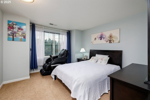 bedroom featuring baseboards and carpet