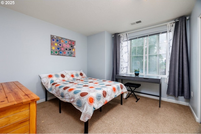 carpeted bedroom featuring baseboards